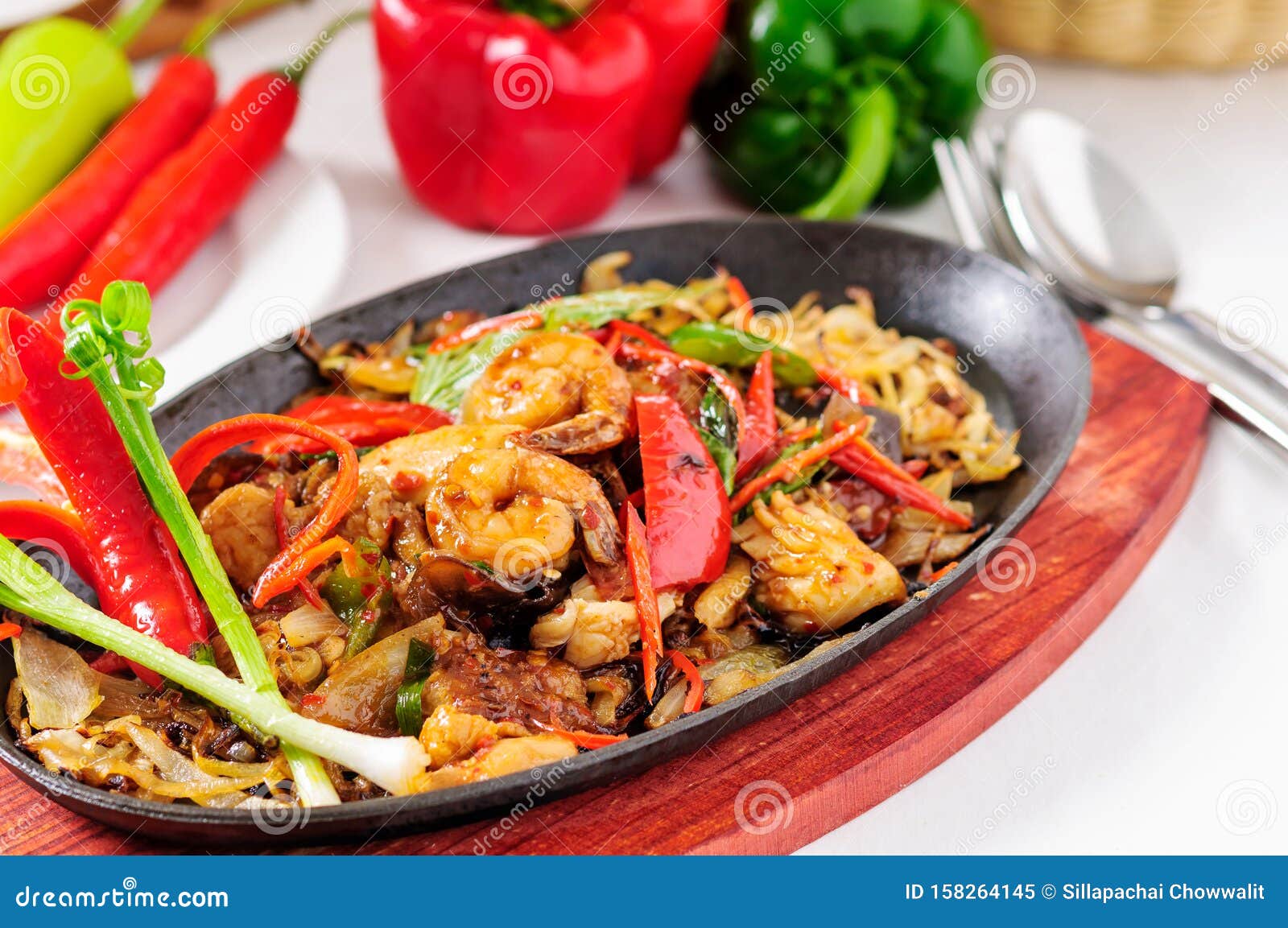 spicy fried seafood on a hot pan